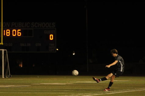 Daniel Pepe takes a penalty kick from the sideline. 