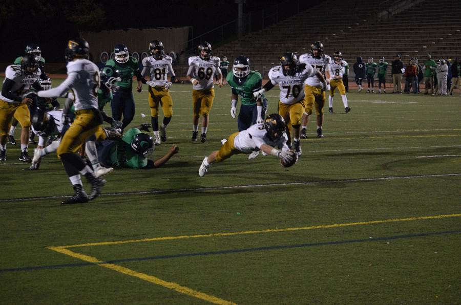 Junior+Alex+Smith+dives+for+a+touchdown+during+the+game+against+Overland+after+being+tripped+by+a+lineman.