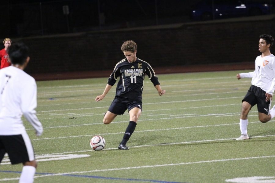 Zander Hahn takes a free kick against Greeley Central.