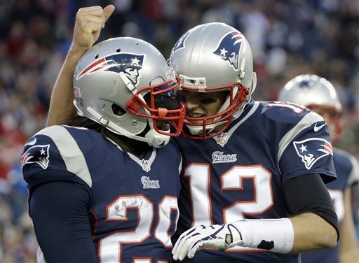 New England Patriots quarterback Tom Brady, right, congratulates running back LeGarrette Blount on his touchdown in the fourth quarter of an NFL football game against the Detroit Lions Sunday, Nov. 23, 2014, in Foxborough, Mass. The Patriots won 34-9. (AP Photo/Steven Senne)