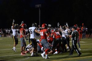 Warrior Football celebrates last year after scoring a touchdown vs Heritage in 2018. The game ended in a 24-28 loss.