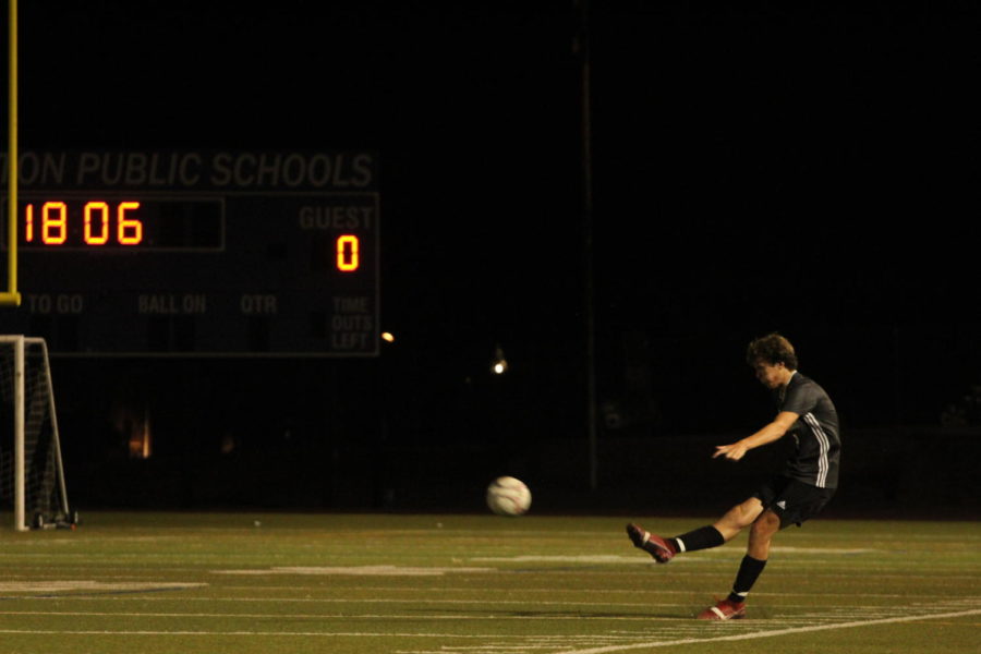 Daniel Pepe takes a penalty kick from the sideline. 