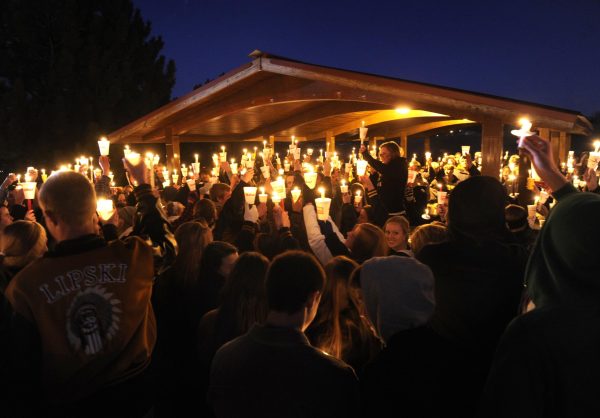 OVER 500 STUDENTS  attended a candlelight vigil on Dec. 14, 2013. The event took place at Arapaho Park and supplies for the event were donated by local businesses. The Arapahoe community really came together at a time when it was needed where they shared prayers for Claire and held up candles. 
Photo courtesy of The Denver Post